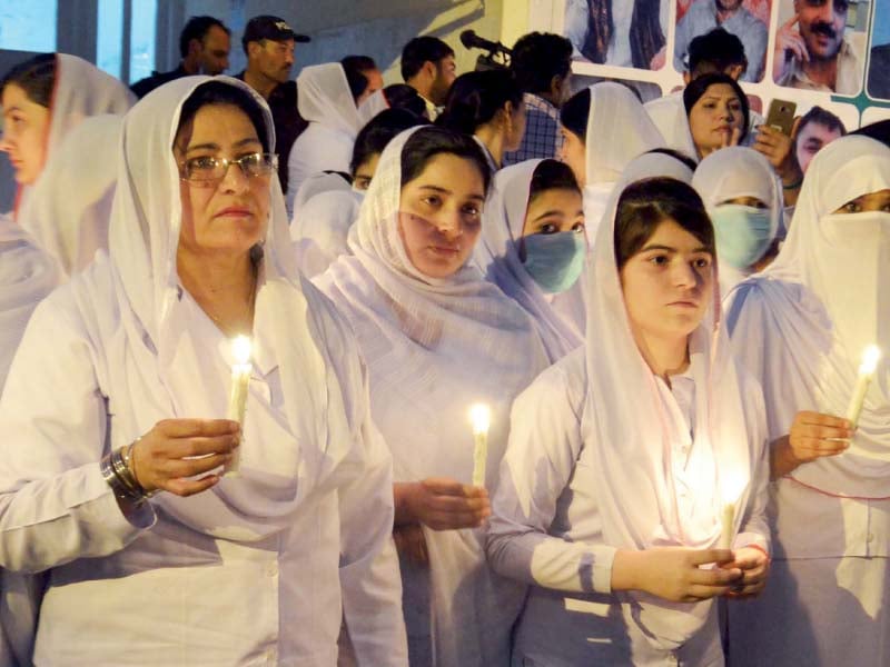 nurses hold a candlelit vigil in memory of the victims of the quetta bombing photo ppi