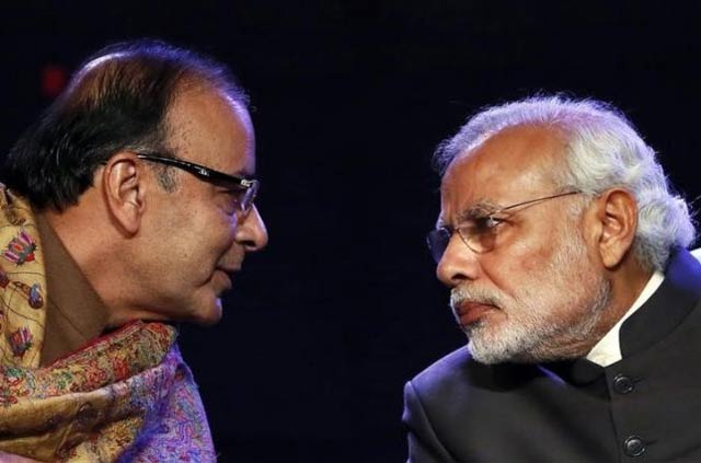 prime minister narendra modi r listens to finance minister arun jaitley during the global business summit in new delhi january 16 2015 photo reuters