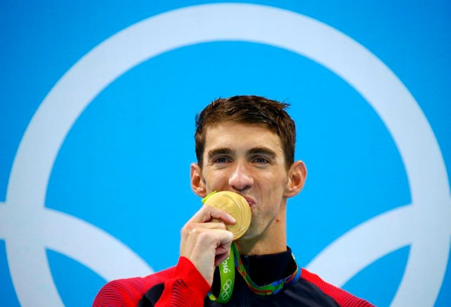 michael phelps usa of usa poses with his gold medal at 2016 rio olympics victory ceremony of men 039 s 200m butterfly at olympic aquatics stadium rio de janeiro brazil on august 9 2016 photo reuters michael phelps usa of usa poses with his gold medal at 2016 rio olympics victory ceremony of men 039 s 200m butterfly at olympic aquatics stadium rio de janeiro brazil on august 9 2016 photo reuters