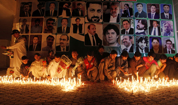 residents light candles for lawyers killed during the monday blast at civil hospital during a candle light vigil in quetta august 9 2016 photo reuters