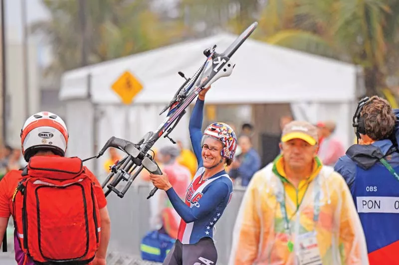 armstrong celebrates after winning gold at the women s individual time trial event to complete a hat trick of gold medals photo afp armstrong celebrates after winning gold at the women s individual time trial event to complete a hat trick of gold medals photo afp