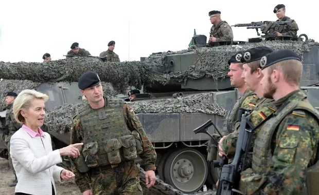 german defence minister ursula von der leyen l speaks with german soldiers after a nato response force nrf exercise in zagan southwest poland on june 18 2015 photo afp german defence minister ursula von der leyen l speaks with german soldiers after a nato response force nrf exercise in zagan southwest poland on june 18 2015 photo afp