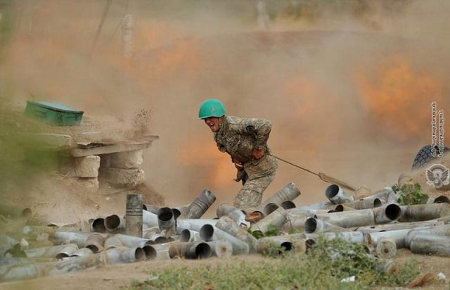 an ethnic armenian soldier fires an artillery piece during fighting with azerbaijan s forces in the breakaway region of nagorno karabakh in this handout picture released september 29 2020 photo reuters an ethnic armenian soldier fires an artillery piece during fighting with azerbaijan s forces in the breakaway region of nagorno karabakh in this handout picture released september 29 2020 photo reuters