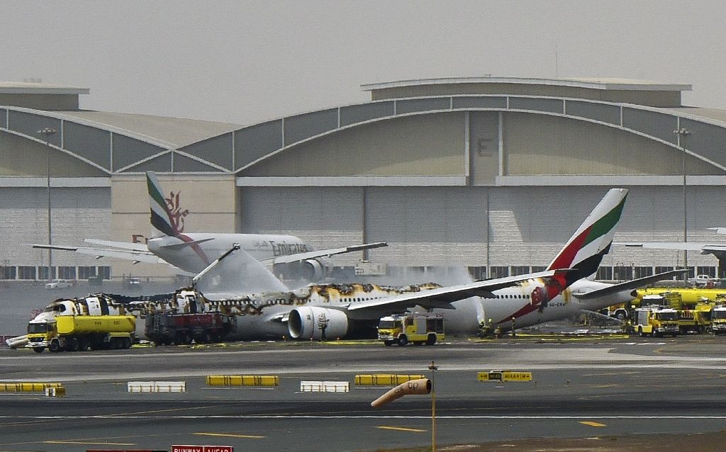 a picture shows a boeing 777 of the uae airliner emirates after it caught fire following a crash landing at dubai airport on august 3 2016 photo afp