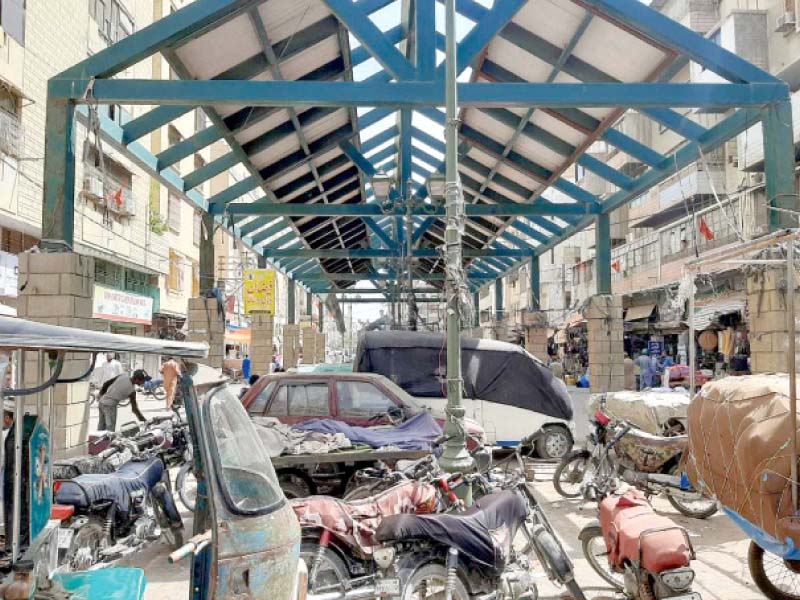 shopkeepers and vendors have begun parking their vehicles and pushcarts under the steel structure meant to house food ki osks at karachi s first planned food street photo express