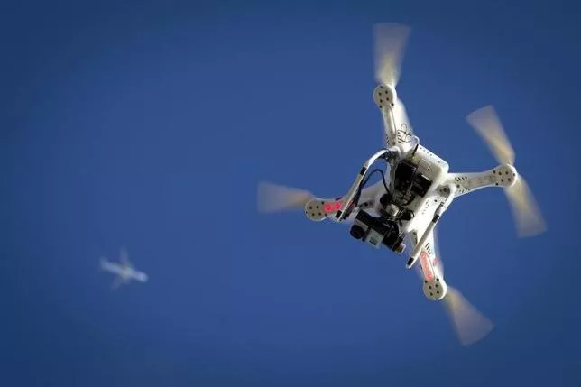 an airplane flies over a drone in the brooklyn borough of new york january 1 2015 photo reuters an airplane flies over a drone in the brooklyn borough of new york january 1 2015 photo reuters