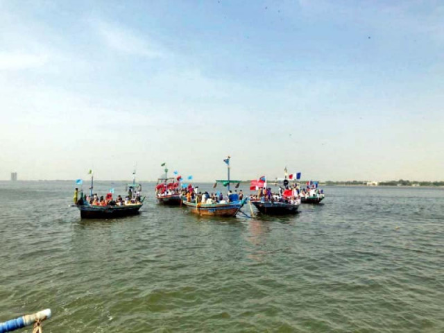 protesters loaded on 25 boats made their way to bhandar and dingi on thursday to register their protest against develop ment on the islands however they were blocked from reaching dingi photo express protesters loaded on 25 boats made their way to bhandar and dingi on thursday to register their protest against develop ment on the islands however they were blocked from reaching dingi photo express