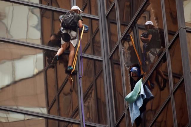 officers from the nypd attempt to detain a man as he climbs the outside of trump tower photo reuters officers from the nypd attempt to detain a man as he climbs the outside of trump tower photo reuters