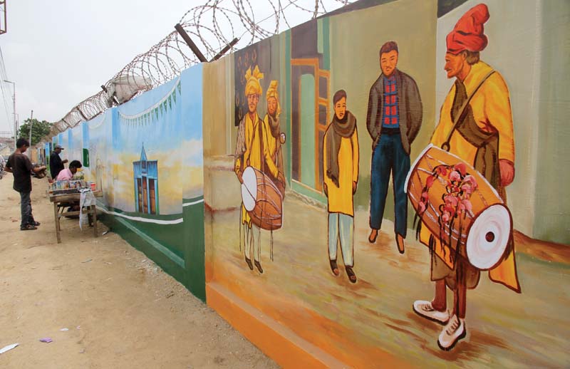 abdoz arts is painting walls with scenes from karachi s street life and national monuments in a bid to reclaim public spaces and bring art to the public photos athar khan express