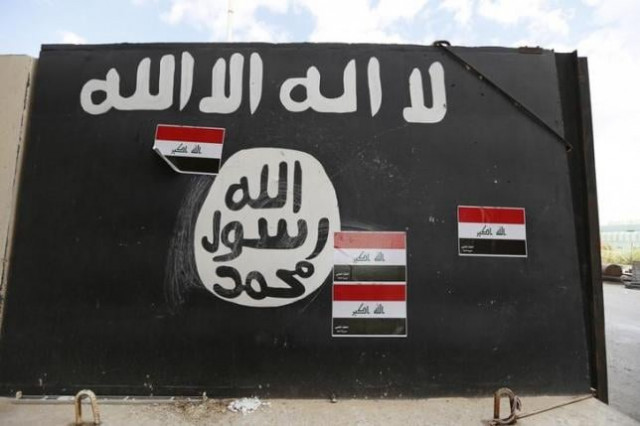 a wall painted with the black flag commonly used by islamic state militants photo reuters a wall painted with the black flag commonly used by islamic state militants photo reuters