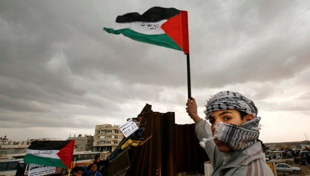 a palestinian waves a flag near a destroyed section of the border wall between the gaza strip and egypt january 29 2008 israel will not stand in the way of palestinian president mahmoud abbas taking control of gaza 039 s breached border with egypt as part of a deal to sideline hamas islamists who rule the enclave officials said on tuesday photo reuters a palestinian waves a flag near a destroyed section of the border wall between the gaza strip and egypt january 29 2008 israel will not stand in the way of palestinian president mahmoud abbas taking control of gaza 039 s breached border with egypt as part of a deal to sideline hamas islamists who rule the enclave officials said on tuesday photo reuters