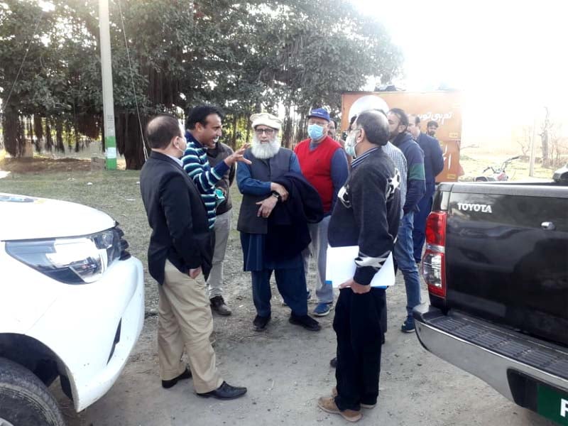 officials of the national engineering services of pakistan lahore ring road authority and public private partnership authority discuss how to save the ancient banyan tree falling on the ring road project photo express