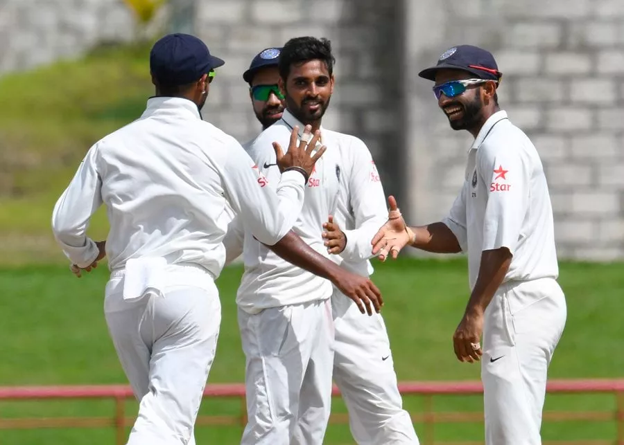 bhuvneshwar kumar c celebrates with ajinkya rahane r of india taking 5 west indies wickets for 33 runs during day 4 of the 3rd test between west indies and india on august 12 2016 at darren sammy national cricket stadium gros islet st lucia photo afp bhuvneshwar kumar c celebrates with ajinkya rahane r of india taking 5 west indies wickets for 33 runs during day 4 of the 3rd test between west indies and india on august 12 2016 at darren sammy national cricket stadium gros islet st lucia photo afp
