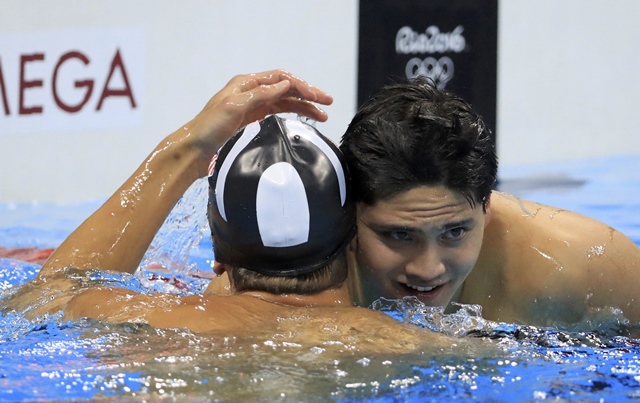 phelps congratulates schooling photo reuters