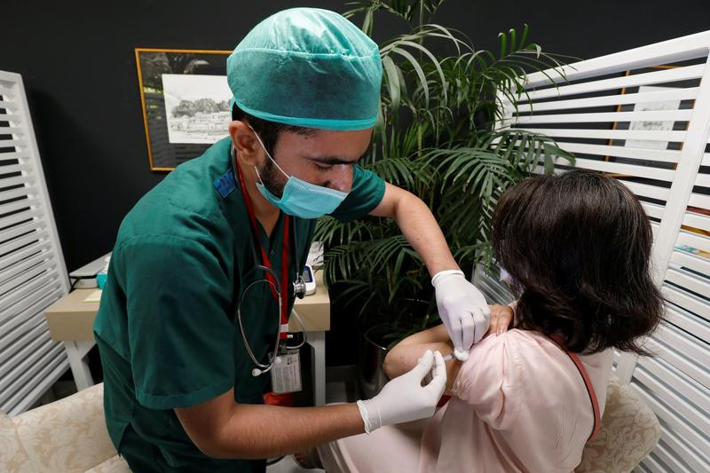 a resident receives a commercial dose of russia s sputnik v coronavirus disease covid 19 vaccine at a private hospital in karachi on april 4 2021 photo reuters