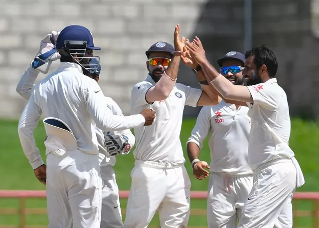 virat kohli c celebrates with teammates at darren sammy national cricket stadium on gros islet st lucia photo afp virat kohli c celebrates with teammates at darren sammy national cricket stadium on gros islet st lucia photo afp