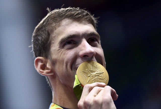 michael phelps poses with his gold medal photo reuters