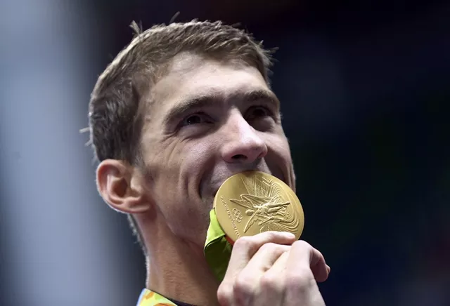 michael phelps poses with his gold medal photo reuters michael phelps poses with his gold medal photo reuters