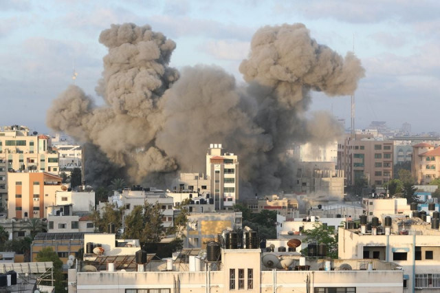 smoke rises following an israeli air strike on a building amid a flare up of israeli palestinian fighting in gaza city may 18 photo reuters smoke rises following an israeli air strike on a building amid a flare up of israeli palestinian fighting in gaza city may 18 photo reuters