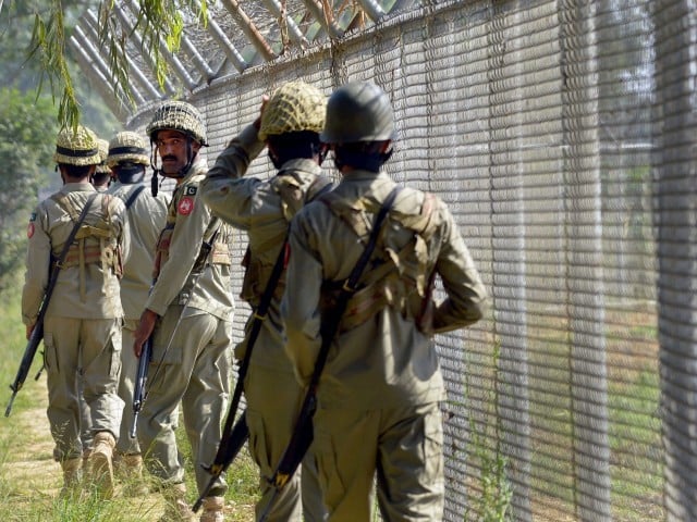 a file photo of pakistani troops patrolling alongside the line of control photo afp