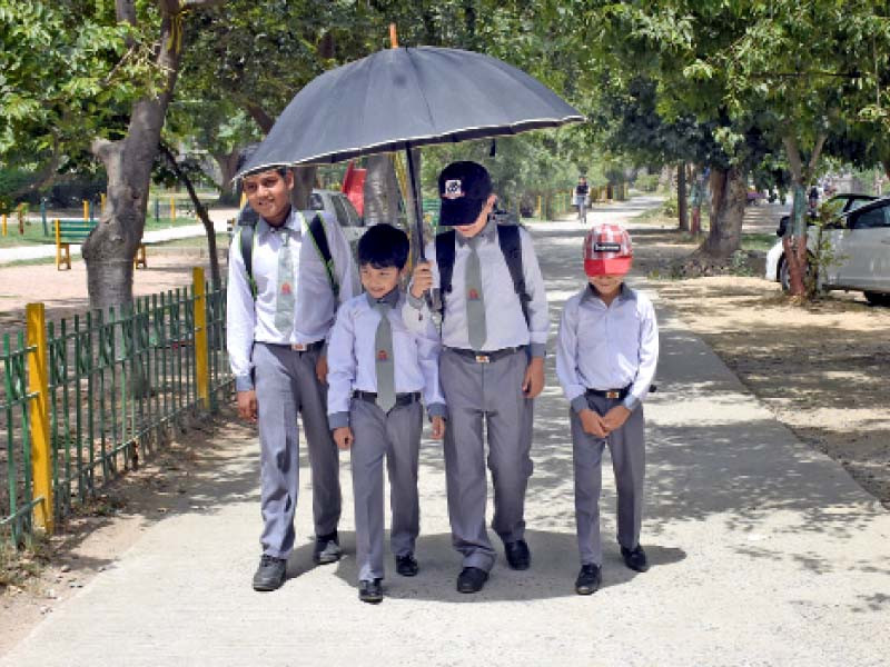 schoolchildren were seen carrying umbrellas in the federal capital to protect themselves against sizzling heat photo online