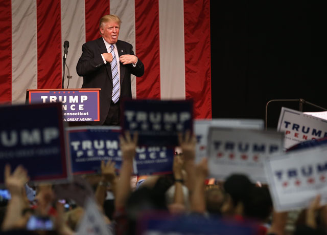 republican presidential candidate donald trump acknowledges the high temperature after addressing supporters on august 13 2016 in fairfield connecticut photo afp