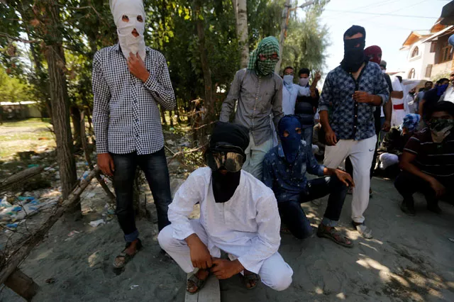 masked protesters pose before the start of a protest against the recent killings in kashmir on the outskirts of srinagar august 5 2016 photo reuters masked protesters pose before the start of a protest against the recent killings in kashmir on the outskirts of srinagar august 5 2016 photo reuters
