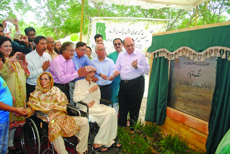 wheelchair bound dr jameel jalibi who arrived at ku in an ambulance due to his ailing health unveils the foundation stone of the new research library being set up by his foundation at the varsity photo courtesy karachi university