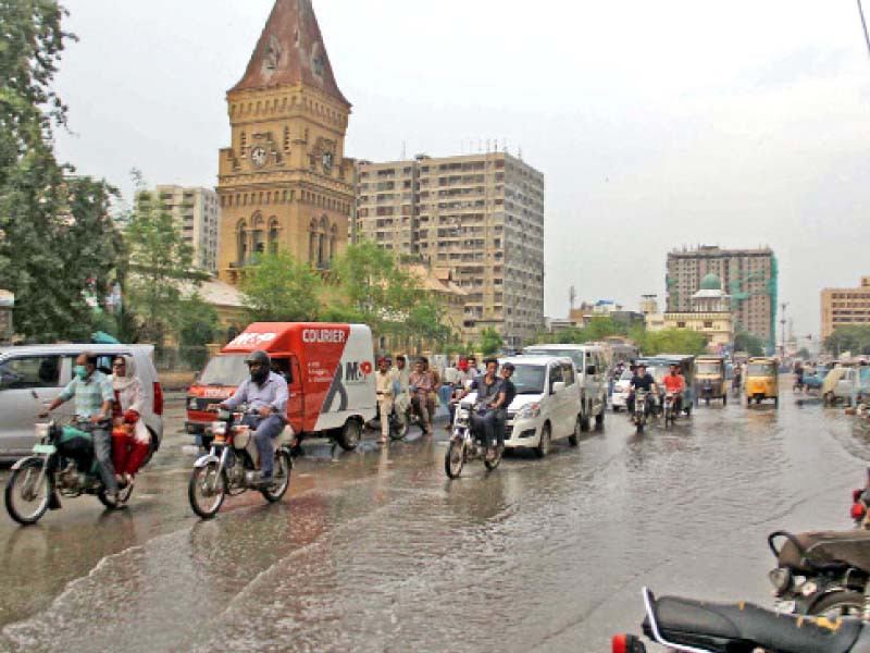 motorists drive past the wet roads of empress market as moderate rainfall hit various parts of the city on wednesday photo online