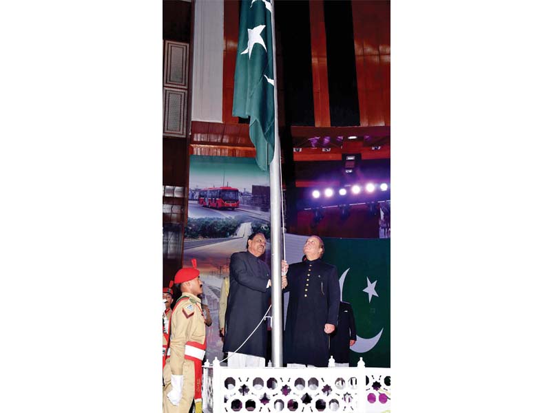 president mamnoon and pm nawaz hoist the national flag at the convention centre photo inp