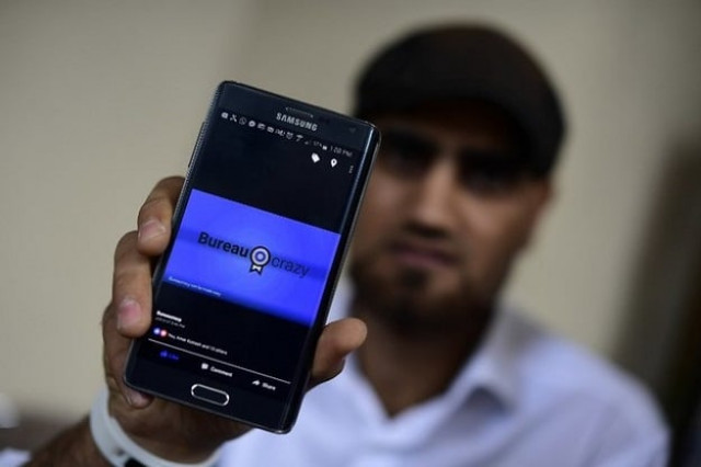 omar alshafai holds his mobile phone for a picture photo afp omar alshafai holds his mobile phone for a picture photo afp