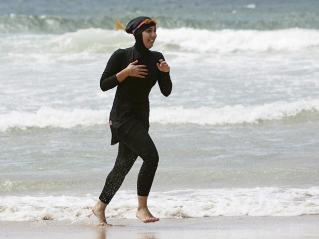 volunteer surf life saver mecca laalaa runs along a beach in sydney photo reuters volunteer surf life saver mecca laalaa runs along a beach in sydney photo reuters