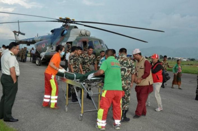 nepalese army personnel assist a victim of a bus accident after being airlifted from birtadeurali in kavre to kathmandu nepal august 15 2016 photo reuters nepalese army personnel assist a victim of a bus accident after being airlifted from birtadeurali in kavre to kathmandu nepal august 15 2016 photo reuters