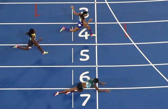 shaunae miller throws herself across the finish line to win the gold photo reuters