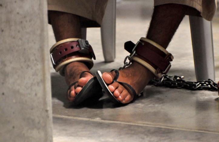 in this photo reviewed by a us department of defense official a guantanamo detainee 039 s feet are shackled to the floor as he attends a 039 life skills 039 class inside the camp 6 high security detention facility at guantanamo bay us naval base april 27 2010 photo reuters