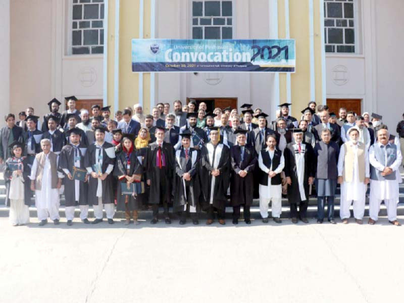 teachers and students of the university of peshawar pose for a photograph with special assistant to cm kamran bangash at the convocation photo express