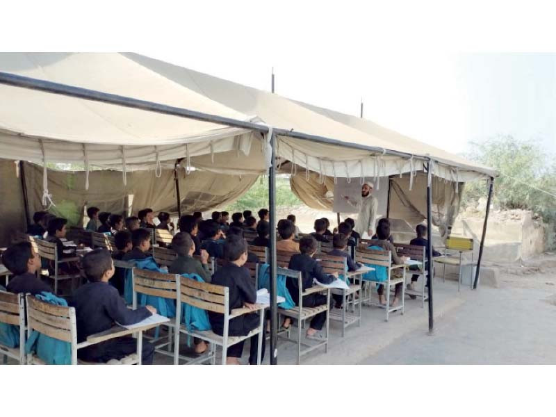 students attend a class in a tent in government primary school alamgudar bara in khyber tribal district photo express