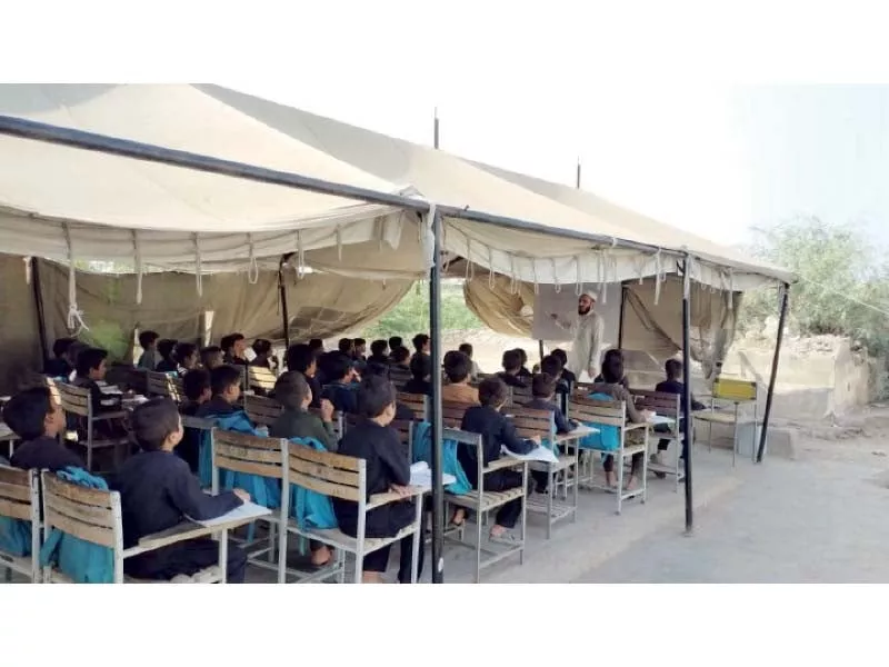students attend a class in a tent in government primary school alamgudar bara in khyber tribal district photo express students attend a class in a tent in government primary school alamgudar bara in khyber tribal district photo express
