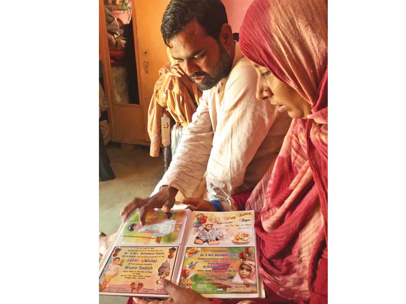 faiz rehman and his wife showcasing the artwork of their six year old daughter who was killed seven months ago photo file