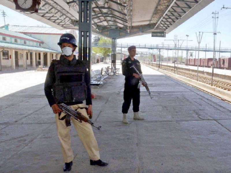 two policemen stand at the ready at railway station in quetta on thursday photo ppi