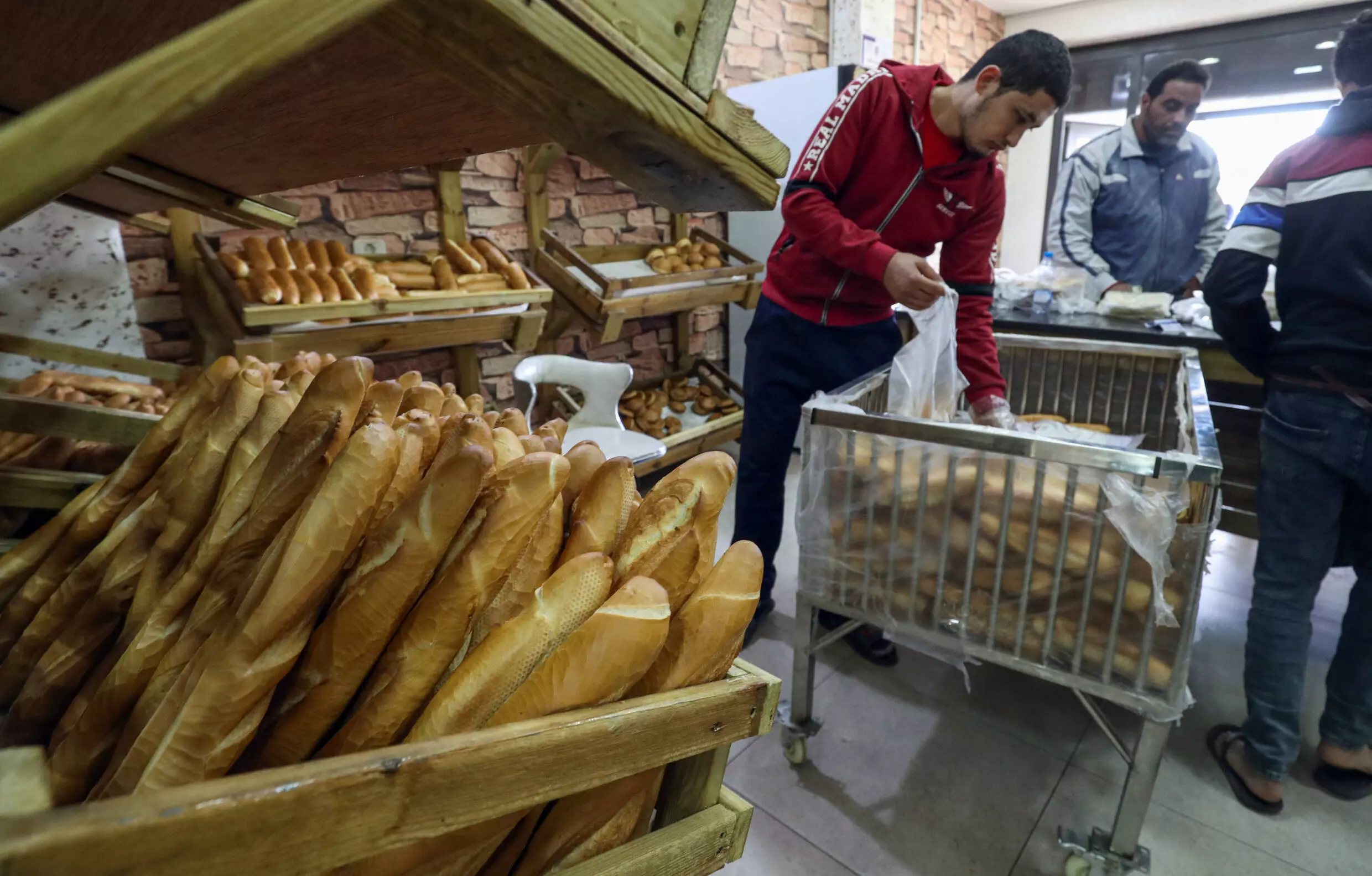 A baker with fresh loaves in the El Menzah area of Tunis. AFP