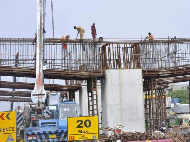contractor in town for inspections concerned about potential delays in completion of the project photo app