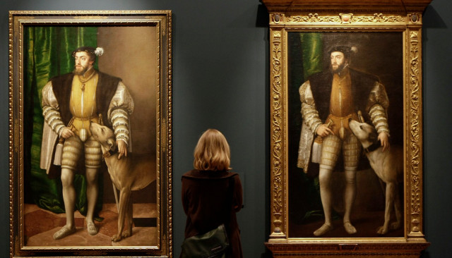 a woman looks at paintings titled quot carlos v con un perro quot by austrian artist jacob seisenegger photo reuters a woman looks at paintings titled quot carlos v con un perro quot by austrian artist jacob seisenegger photo reuters