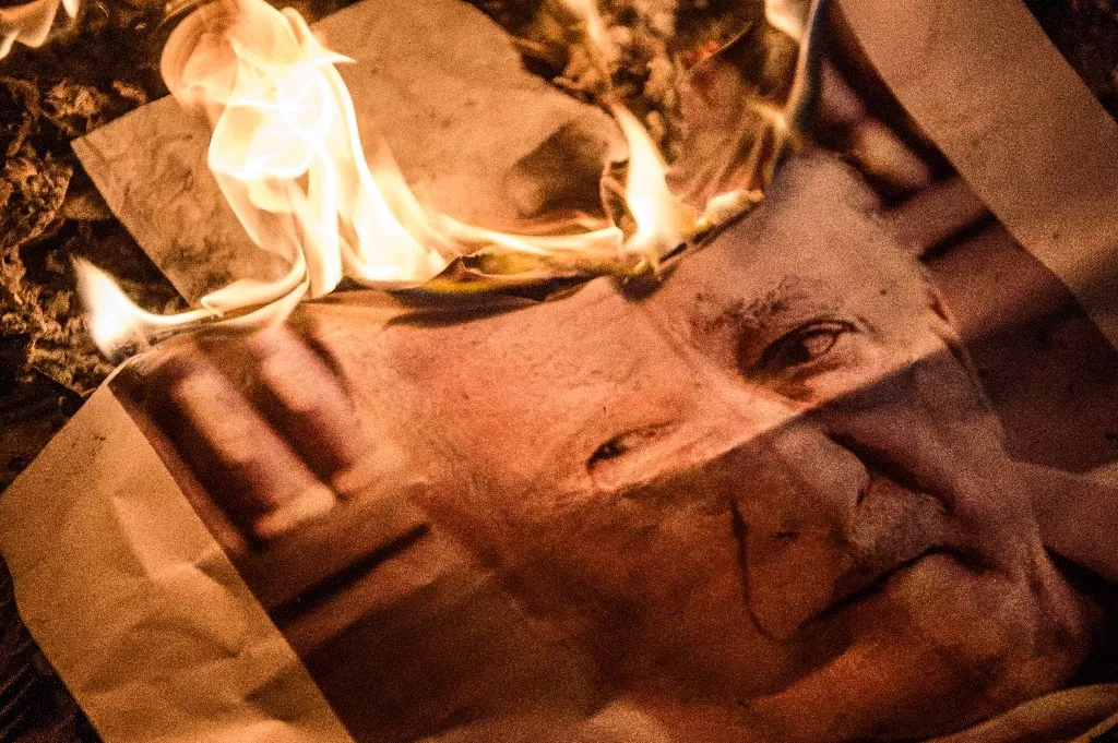 pro erdogan supporters burn a poster picturing us based preacher fethullah gulen during a rally at taksim square in istanbul photo afp pro erdogan supporters burn a poster picturing us based preacher fethullah gulen during a rally at taksim square in istanbul photo afp