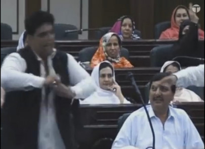 anp leader tears shirt walks out of peshawar district council in protest