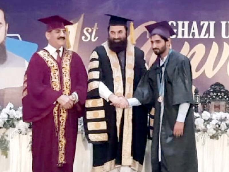 governor balighur rehman shakes hands with one of the position holders during the convocation photo express