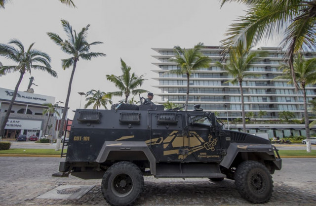 a state police armoured personnel carrier keeps watch outside the restaurant quot la leche quot the milk on august 18 2016 in puerto vallarta jalisco western mexico photo afp a state police armoured personnel carrier keeps watch outside the restaurant quot la leche quot the milk on august 18 2016 in puerto vallarta jalisco western mexico photo afp