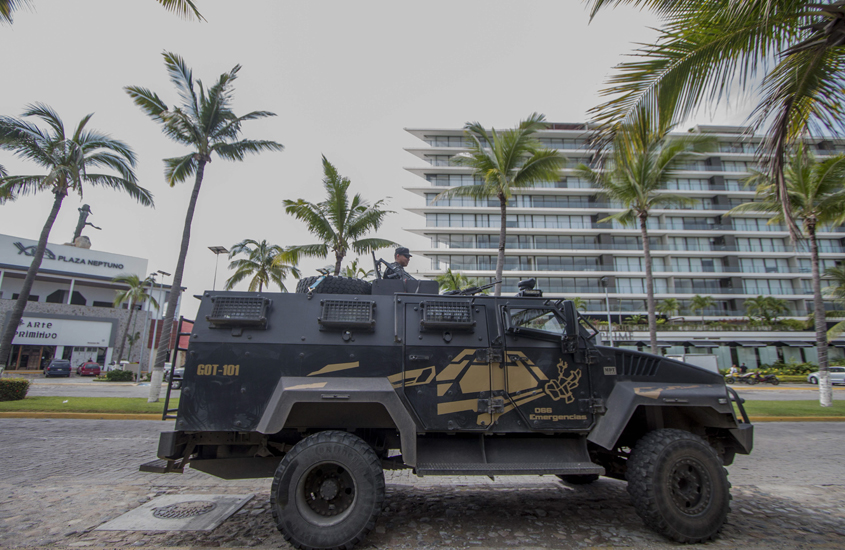 a state police armoured personnel carrier keeps watch outside the restaurant quot la leche quot the milk on august 18 2016 in puerto vallarta jalisco western mexico photo afp