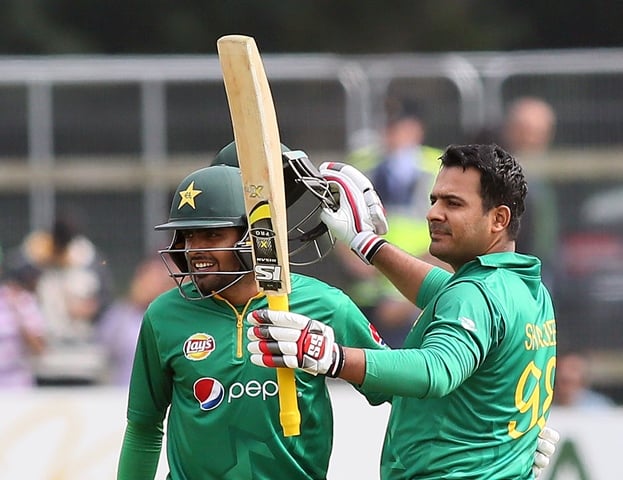 sharjeel khan r celebrates after making a century at the malahide stadium in dublin on august 18 2016 photo afp