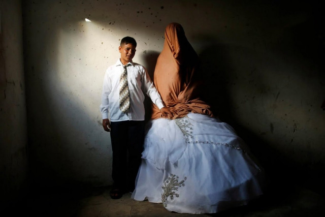 young palestinian groom ahmed soboh 15 and his bride tala 14 stand inside tala 039 s house during their wedding party in the town of beit lahiya near the border between israel and the northern gaza strip photo reuters young palestinian groom ahmed soboh 15 and his bride tala 14 stand inside tala 039 s house during their wedding party in the town of beit lahiya near the border between israel and the northern gaza strip photo reuters
